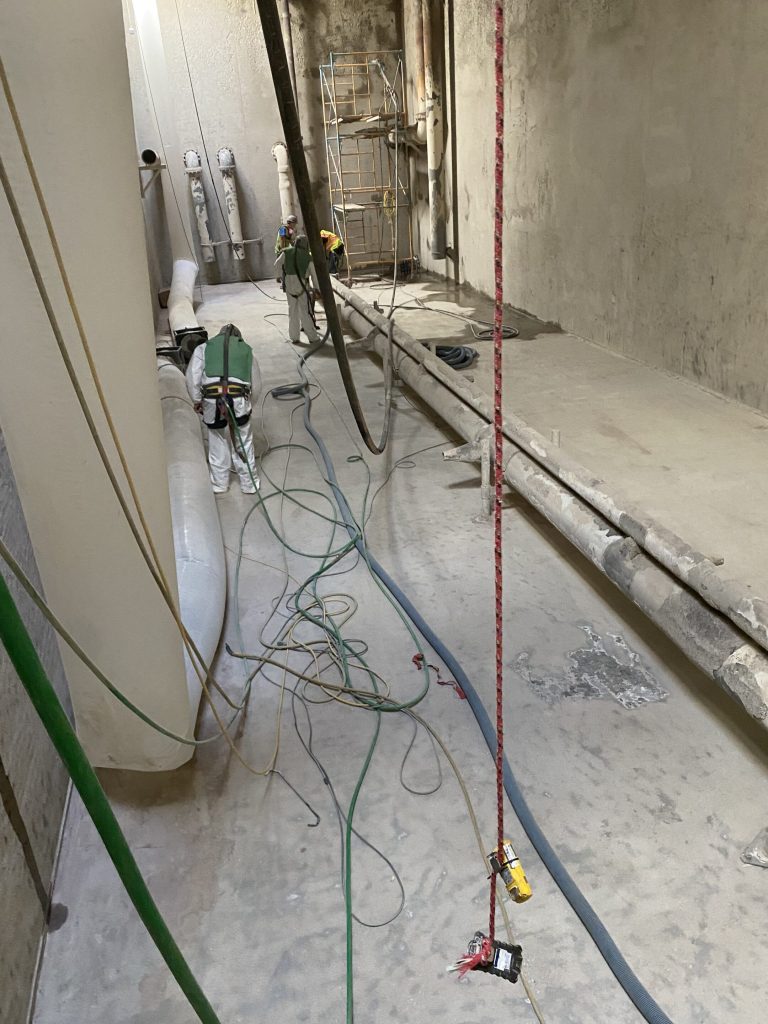 Surface Preparation - deteriorated concrete surface in equalizer tank